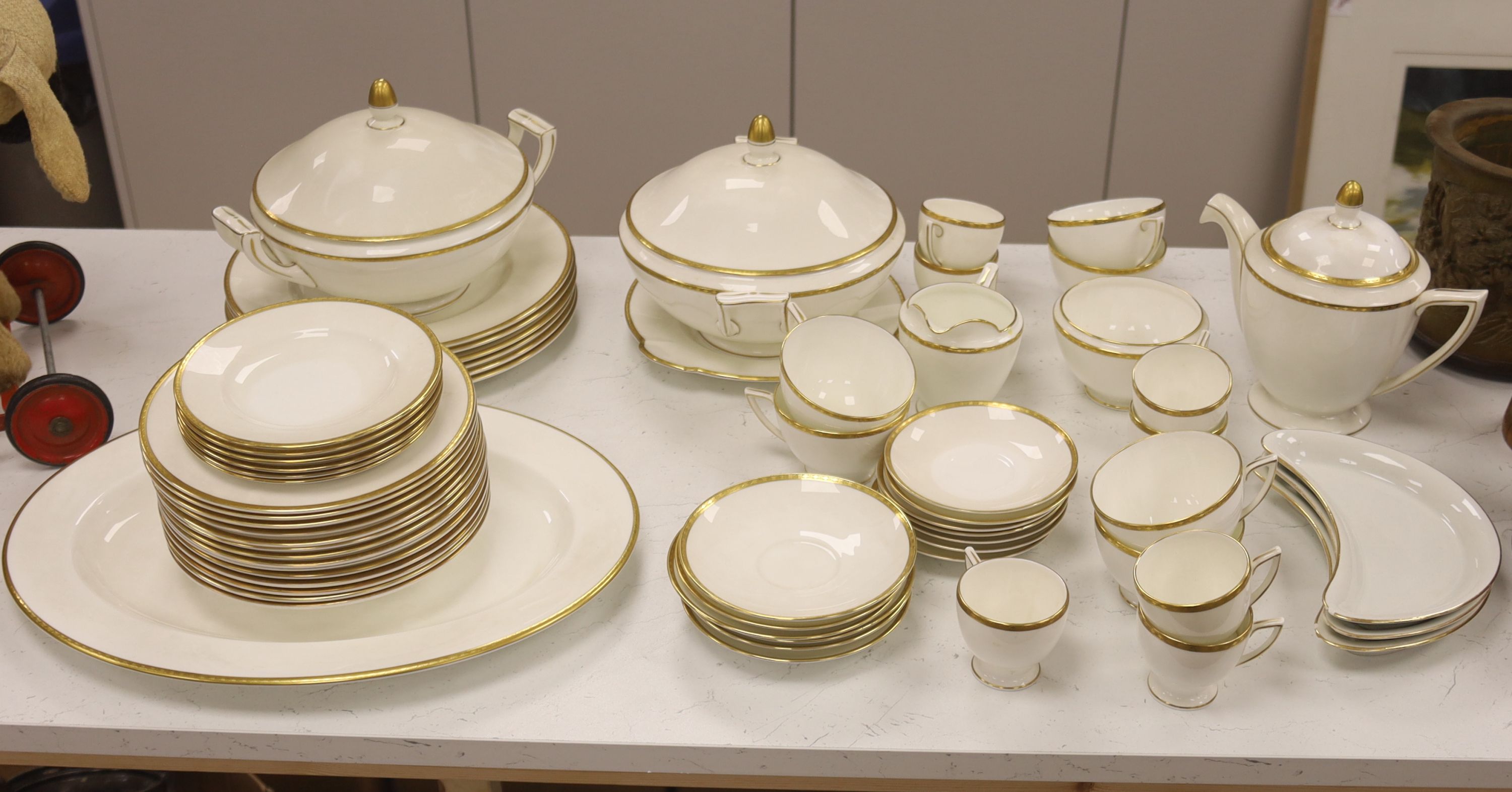 A Minton 'Golden Heritage' gilt bordered dinner service